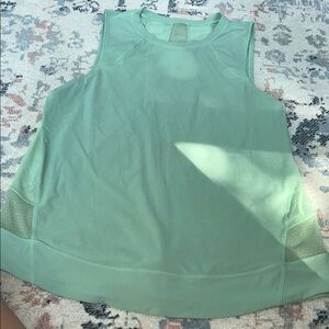 Lululemon tank top tag is missing but I would say a size 8. Great for workouts